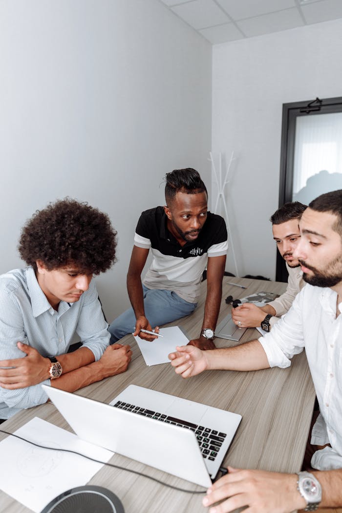 Team of professionals discussing business strategy in a modern office.